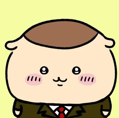 スーツに赤いネクタイを締めて微笑む可愛いくりまんじゅうSNSアイコン