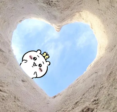 Cute Chiikawa peeking through a heart-shaped sand hole into blue sky PFP